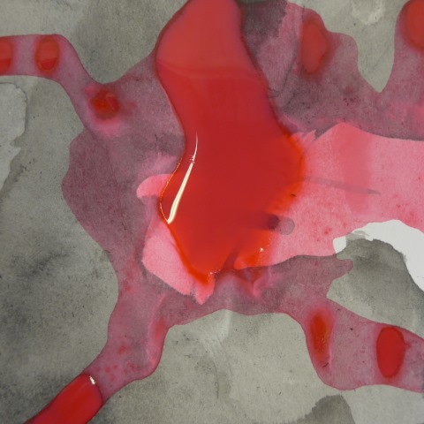 d00097: semi-abstract photo (red paint drying on a grey background in sketchbook) by Ewart Shaw