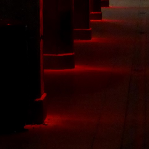 d00392: semi-abstract photo (red-lit pillars at night) by Ewart Shaw