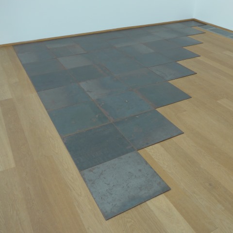 d10299: semi-abstract photo (Carl Andre sculpture (triangular array of steel tiles laid flat)) by Ewart Shaw
