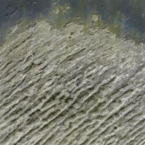 d10947: semi-abstract photo (weathered gravestone in St Mary's churchyard, Scarborough) by Ewart Shaw