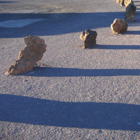 p2157: semi-abstract photo (car park with stones and shadows) by Ewart Shaw