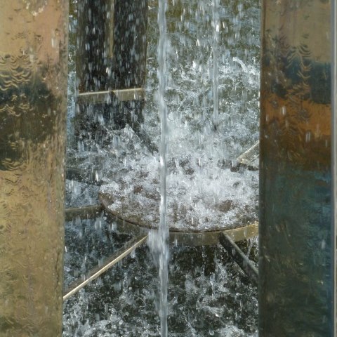 t00653: semi-abstract photo (fountain with metal surround) by Ewart Shaw