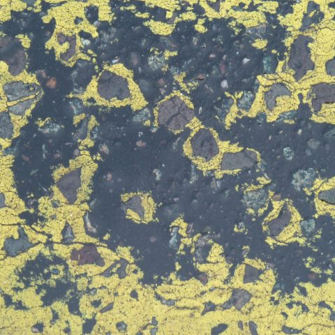 t10423: semi-abstract photo (worn-down yellow paint on road) by Ewart Shaw