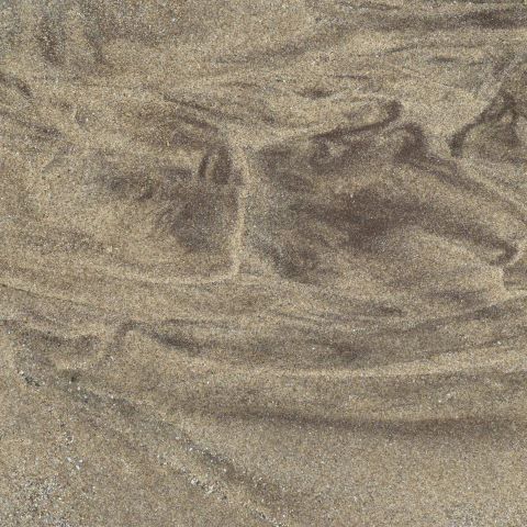t10628: semi-abstract photo (light and dark patterns around a sand footprint) by Ewart Shaw