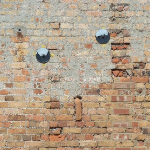 t20332: semi-abstract photo (braces in brick wall) by Ewart Shaw