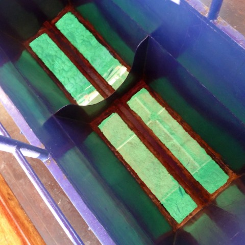 t30804: semi-abstract photo (colourful glass bottom of a glass-bottomed boat) by Ewart Shaw