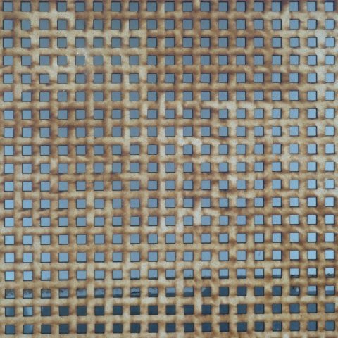t40003: semi-abstract photo (grid of square holes in mdf offcut) by Ewart Shaw